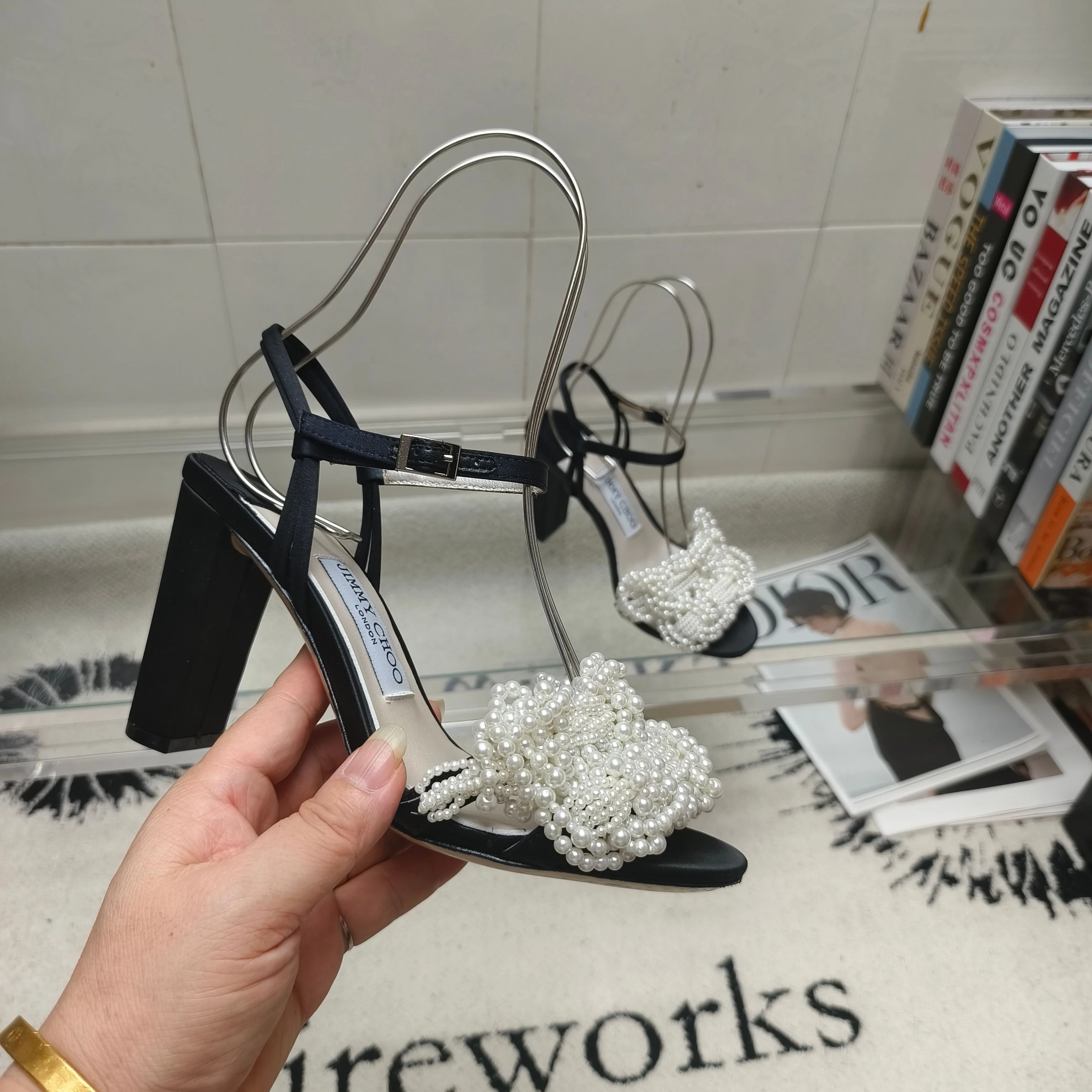 JIMMY CHOO satin pearl mules feature elegant pearl weave and satin