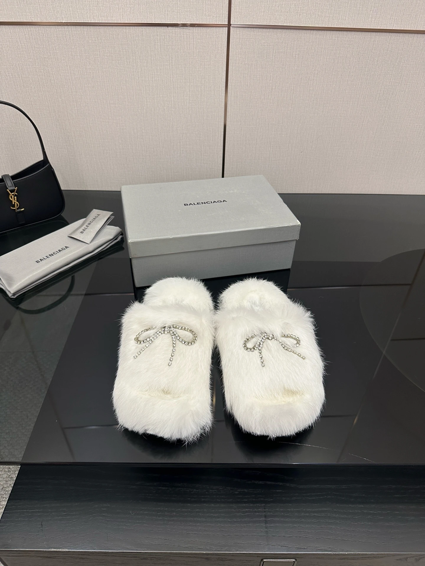Balenciag flat-soled, diamond-buckled fur slippers